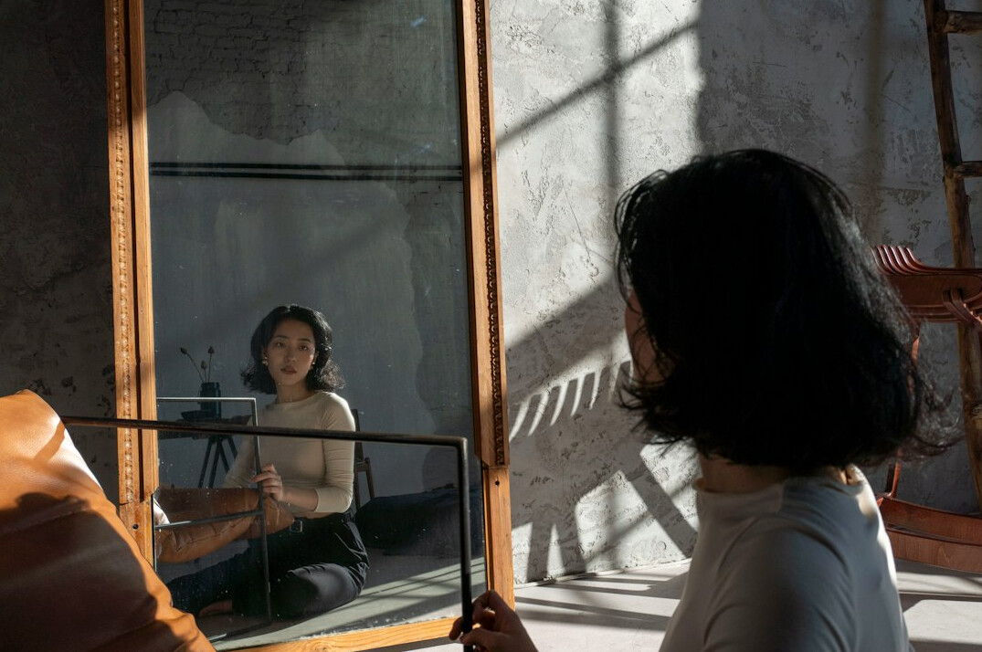 man practicing speech in mirror