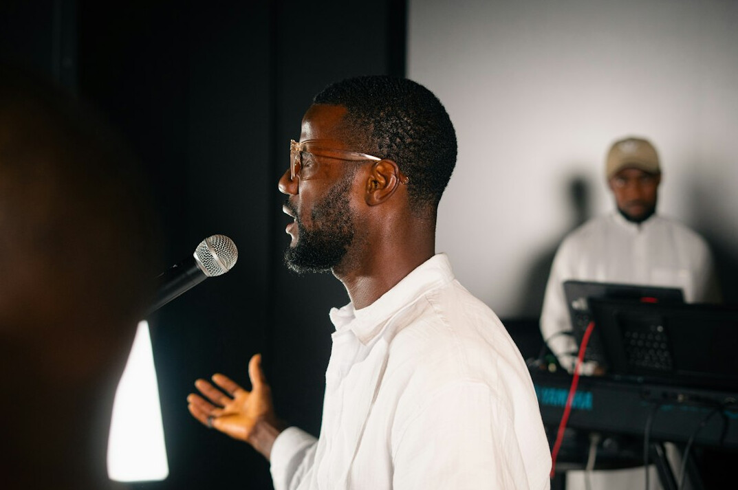 person speaking confidently on stage