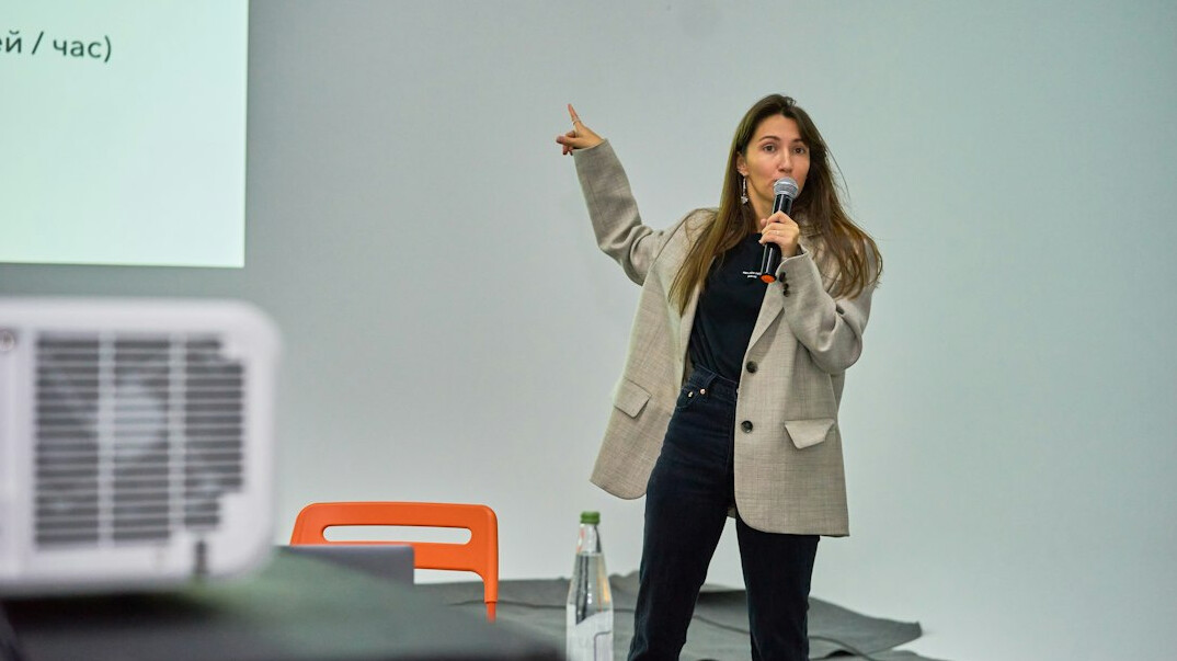confident woman speaking on stage